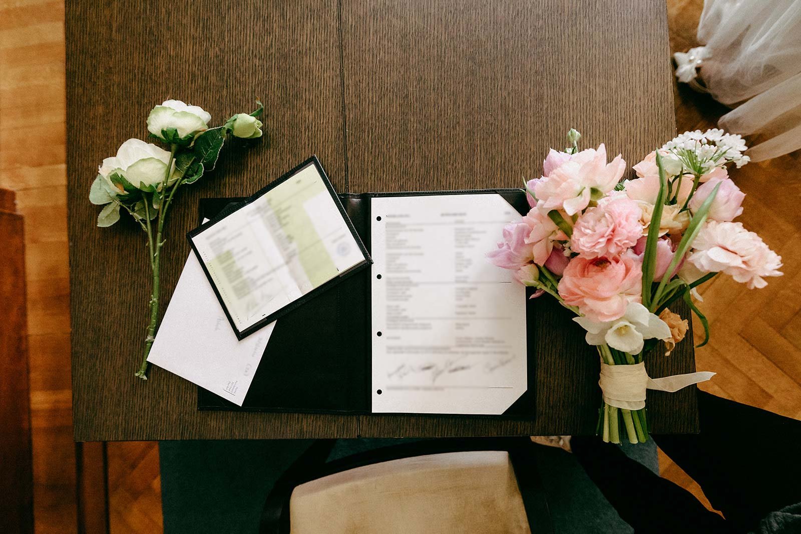 Dutch marriage certificate and official wedding documents displayed on a table after legal registration