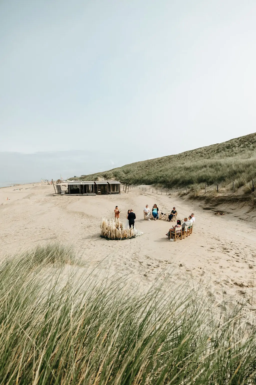 Small beach ceremony on the Dutch coast during an intimate beach elopement near Amsterdam