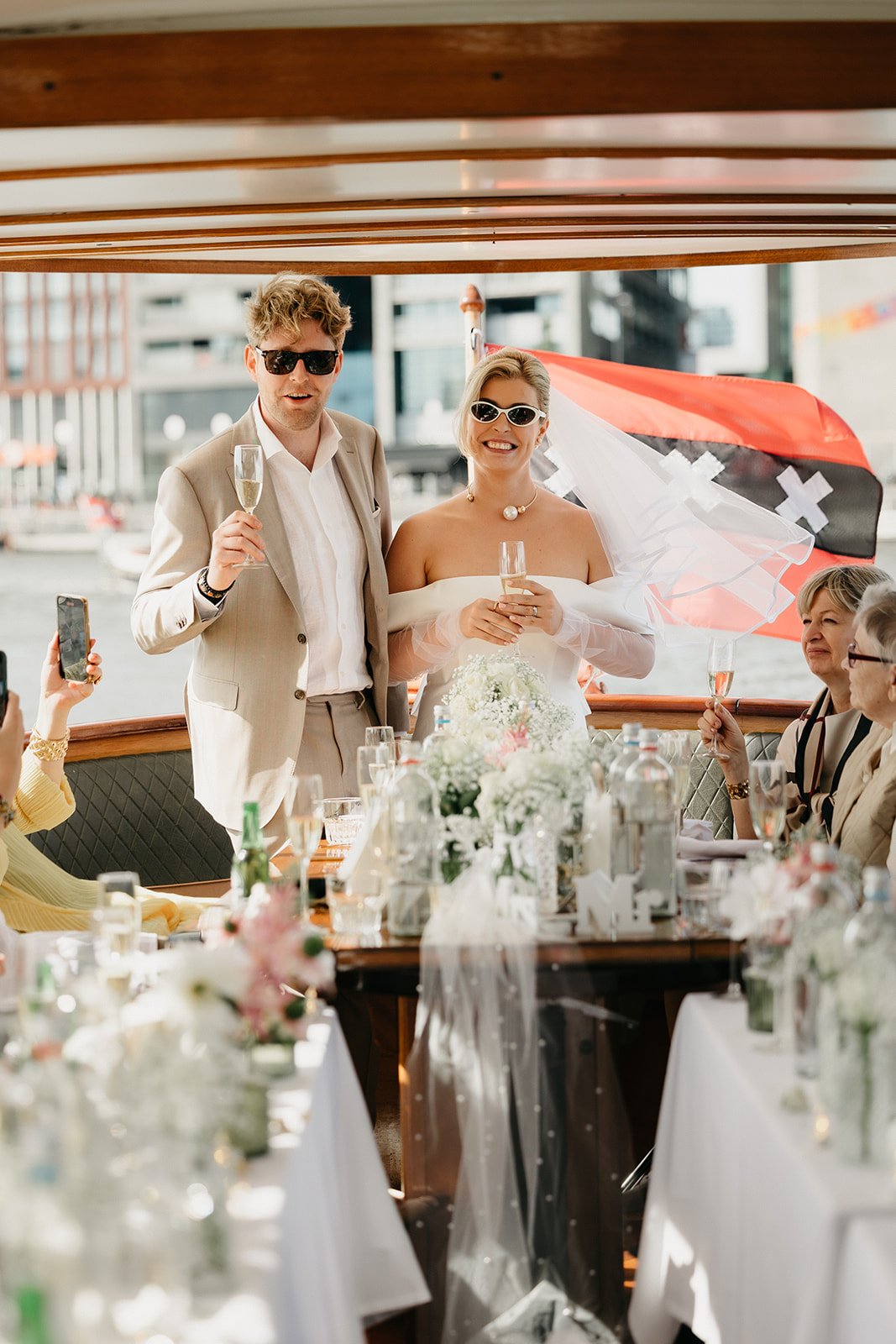Wedding party celebrating together on a boat