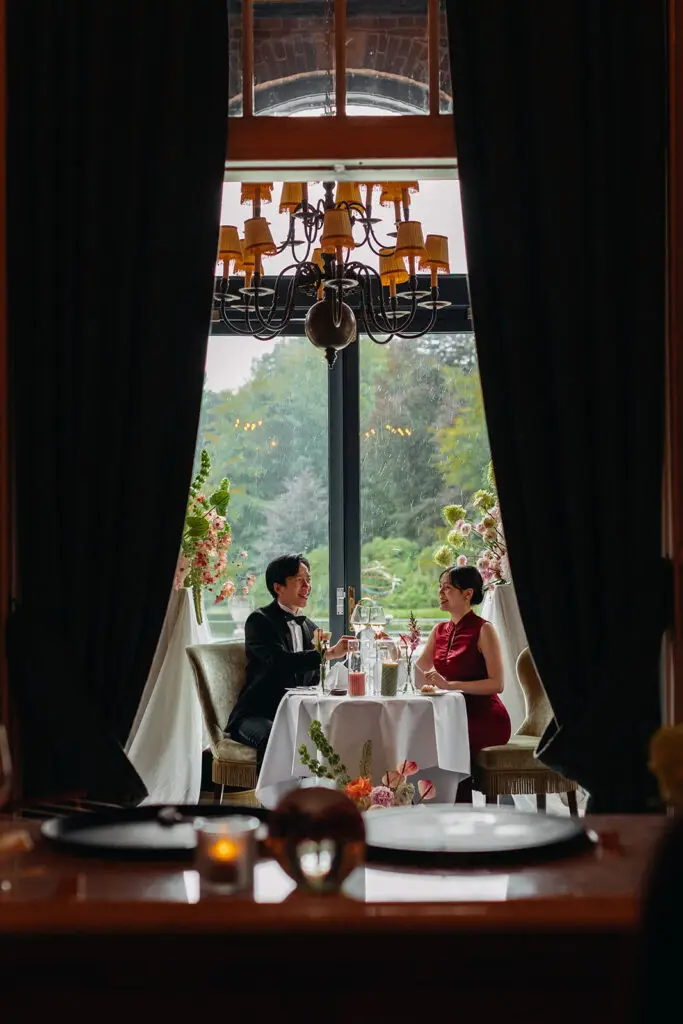 Couple having an intimate dinner at a private waterfront venue in Amsterdam after their elopement