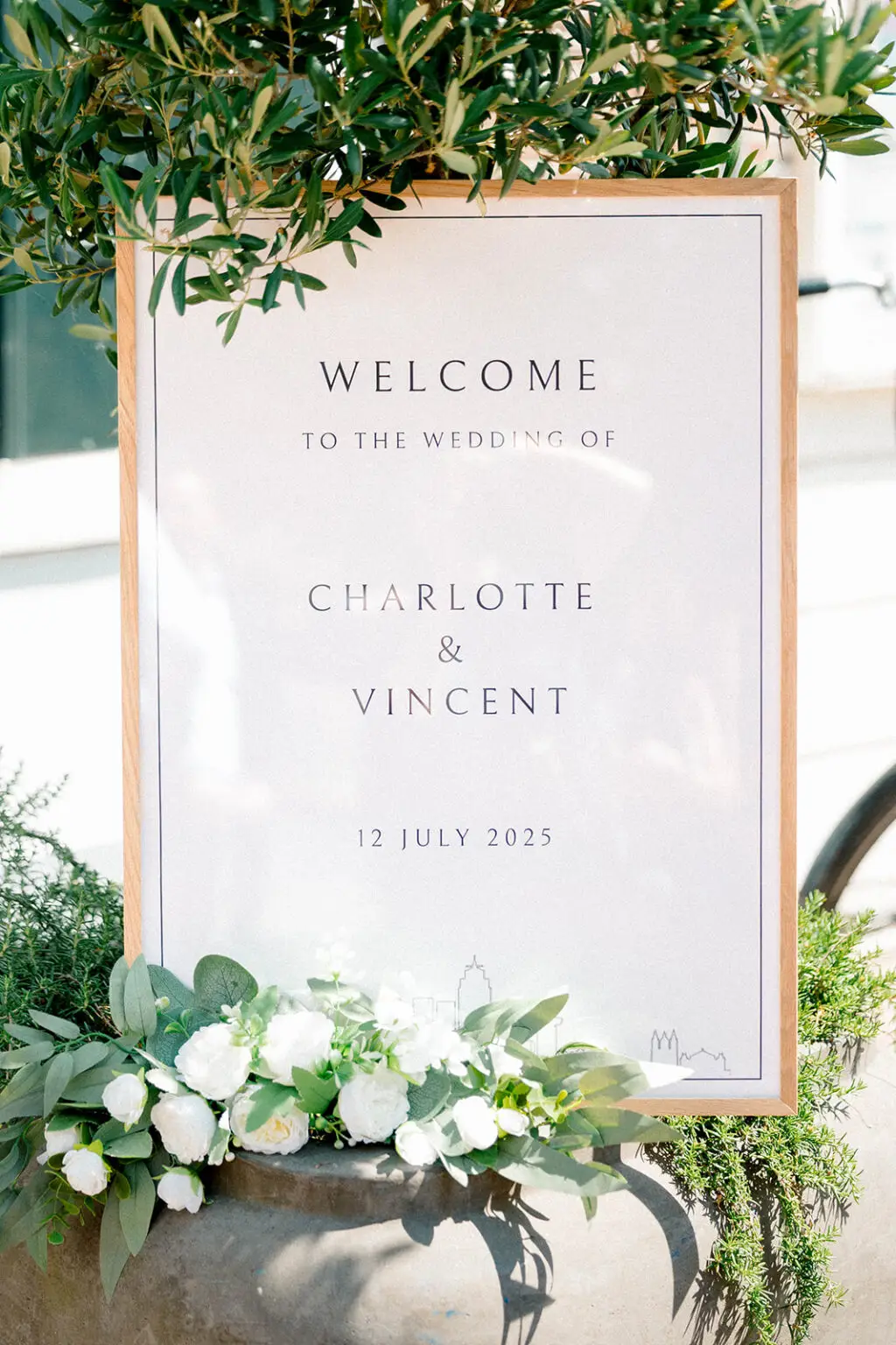 Minimal wedding welcome sign with floral styling at an intimate Amsterdam elopement venue