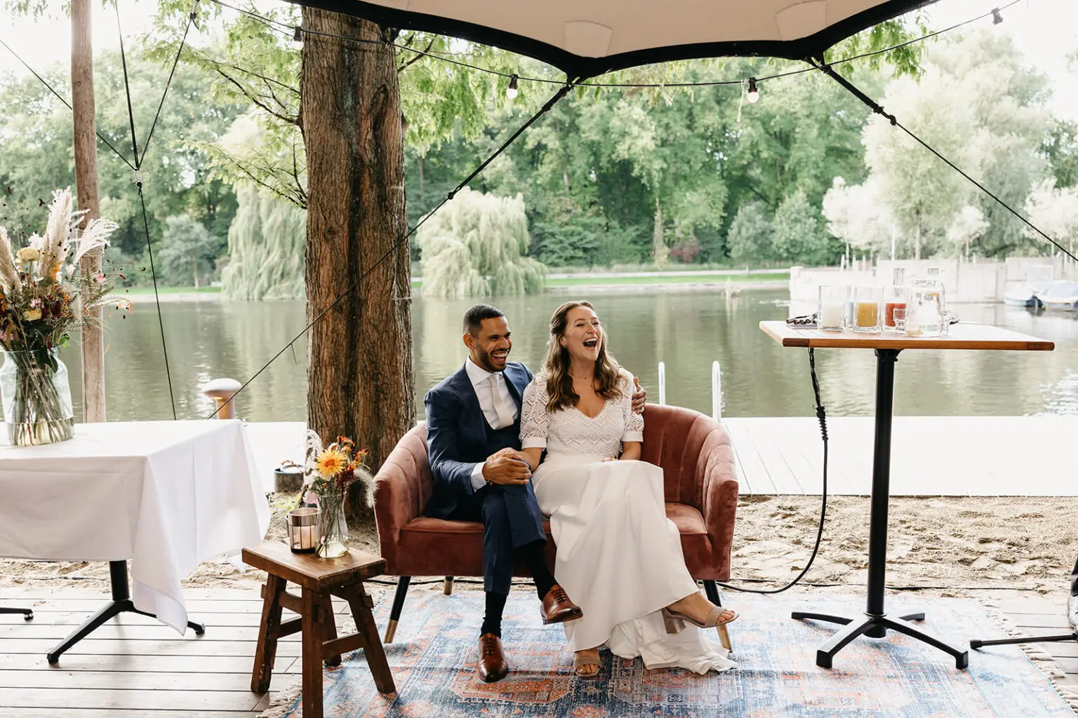 Couple celebrating after their ceremony at a waterfront terrace during an intimate elopement at Strand Zuid Amsterdam