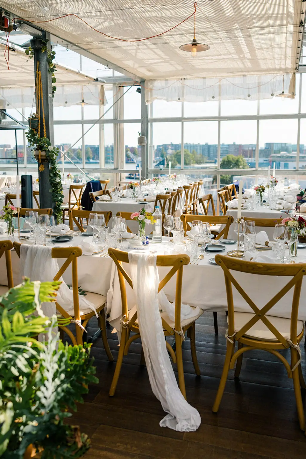 Styled wedding reception tables inside a modern Amsterdam venue for an intimate elopement celebration