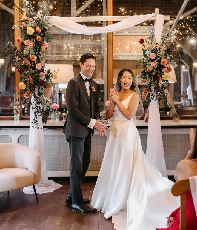 Bride and groom celebrating during an intimate wedding reception in Amsterdam