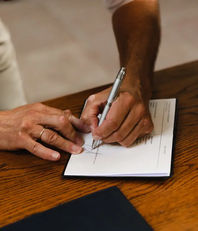 Signing official marriage documents during a civil wedding ceremony in Amsterdam