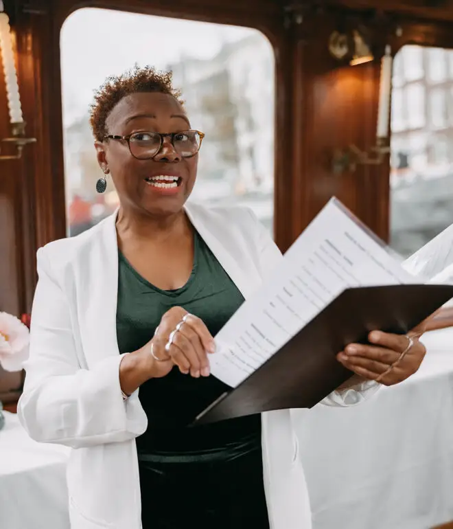 Wedding celebrant speaking during a canal boat ceremony in Amsterdam