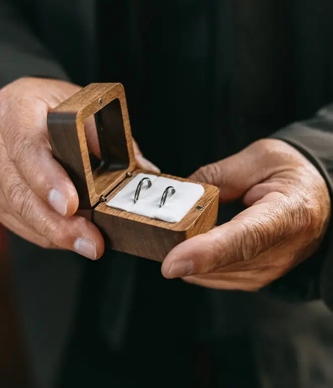 Close-up of wedding rings in a wooden box during a civil wedding ceremony in Amsterdam