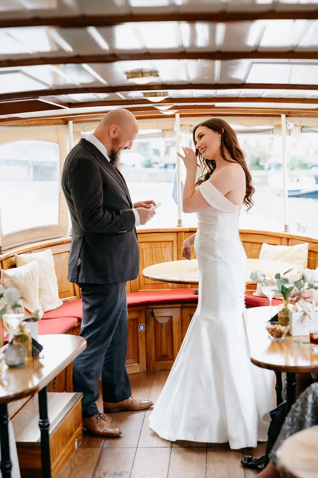 Bride and groom during an intimate canal boat wedding ceremony in Amsterdam