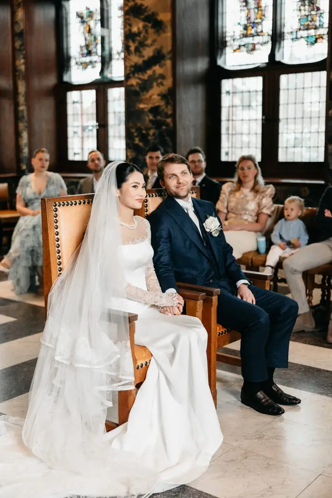 Bride and groom during a wedding ceremony at Stadshuis Gouda in the Netherlands