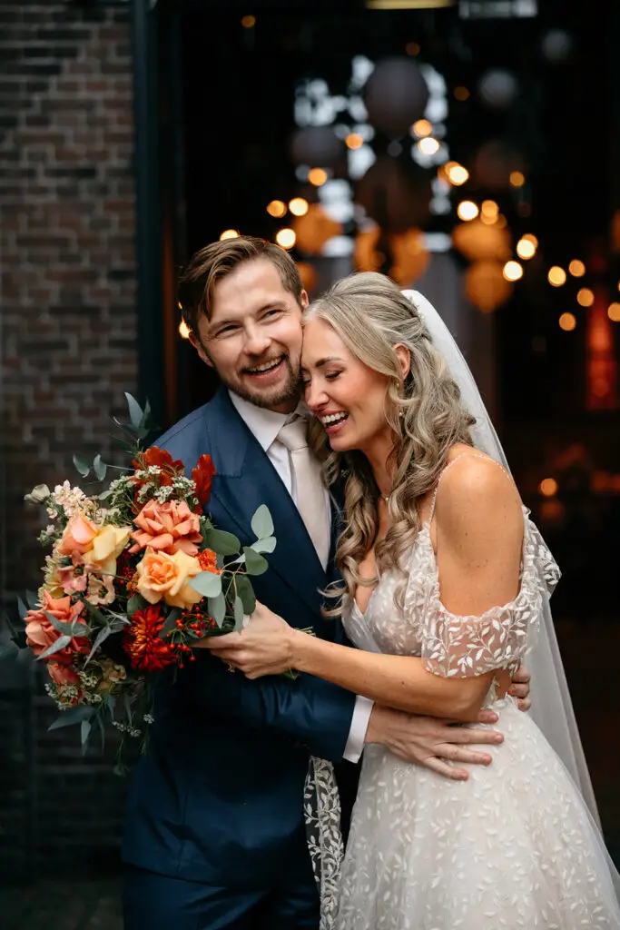 Newly married couple celebrating outside Westerliefde wedding venue in Amsterdam