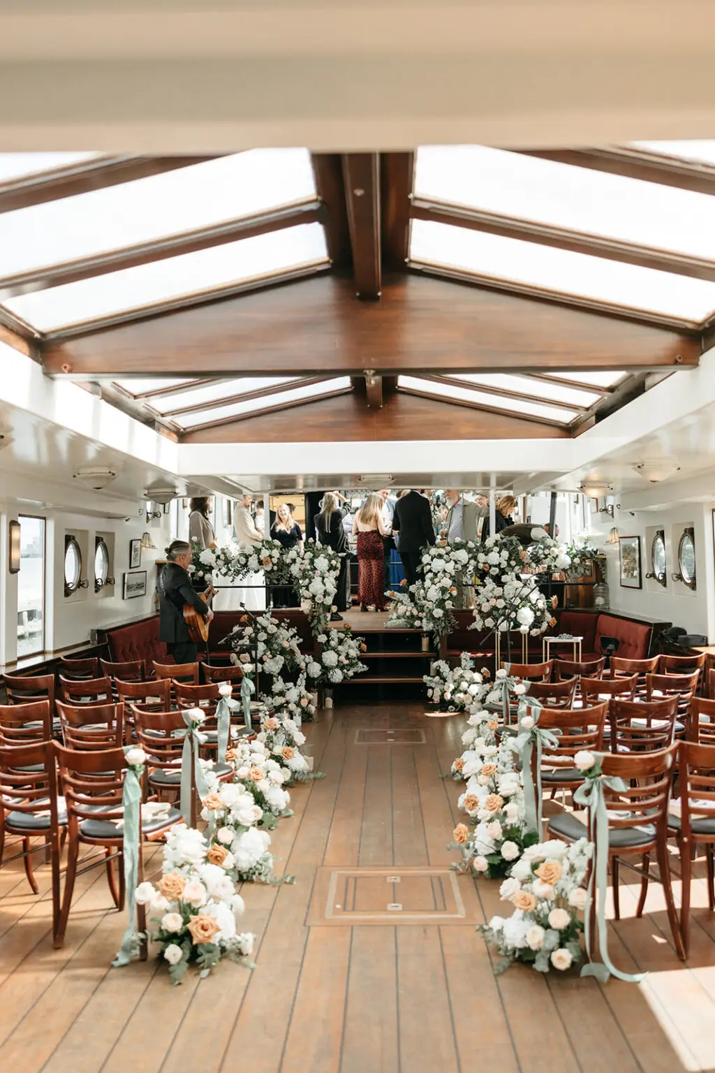 Floral ceremony aisle inside Het Wapen van Amsterdam prepared for a wedding on the Amsterdam canals