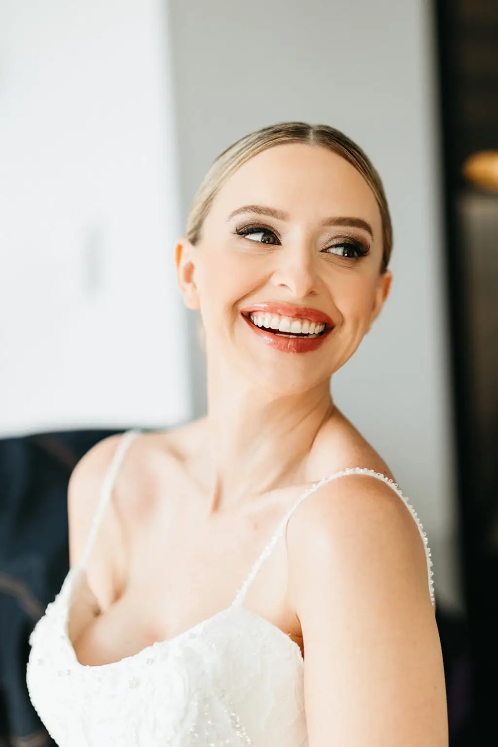 Bride smiling during wedding preparations at Hotel De Witt before a destination wedding in Amsterdam