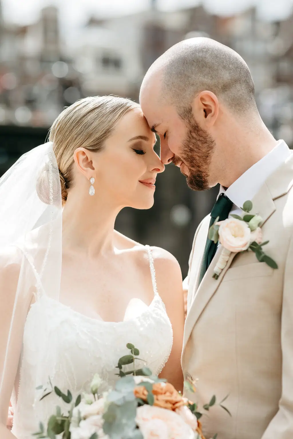 Bride and groom sharing their first look beside Brouwersgracht canal in Amsterdam